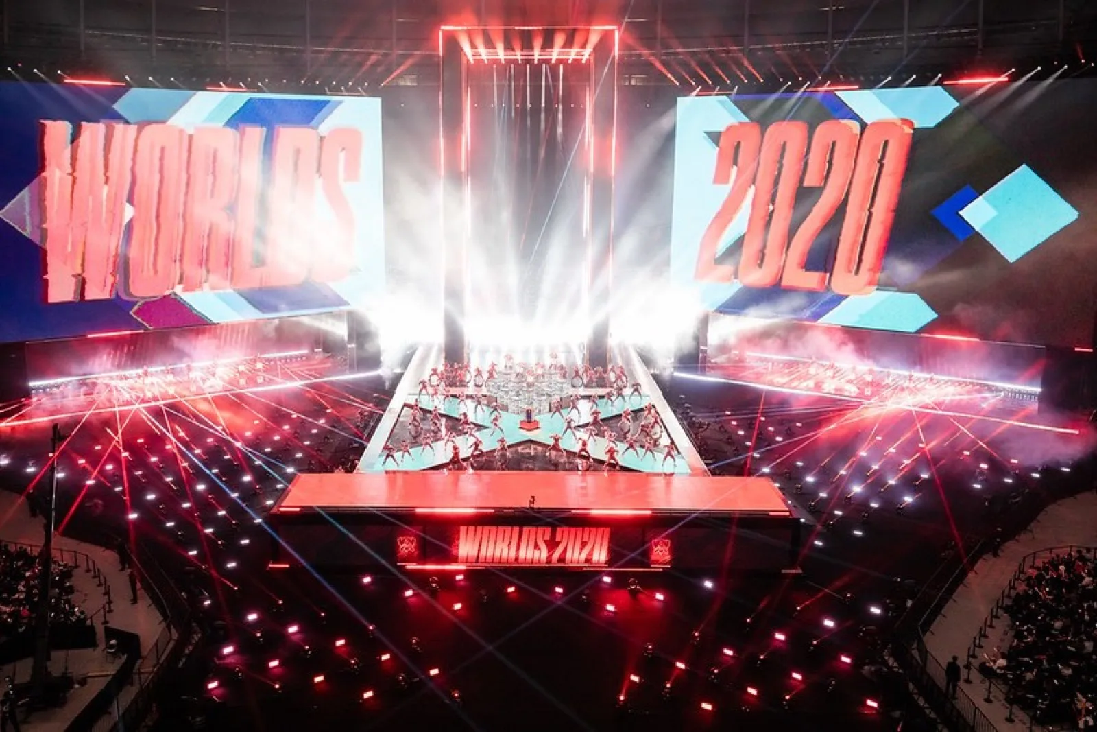Wide view of the Worlds 2020 stage with giant 'WORLDS 2020' screens, laser beams and performers during the Finals opening